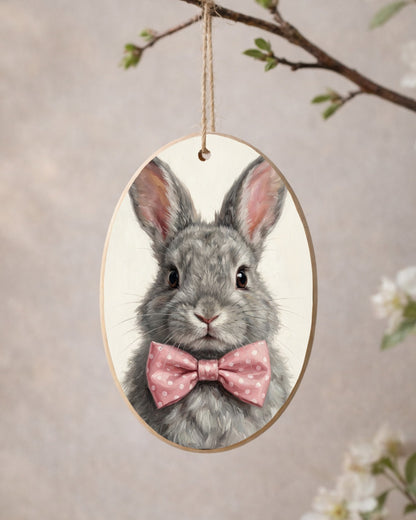 Hasen Poster mit grauem Kaninchen und rosa Schleife als ruhiges Tierportrait für Kinderzimmer